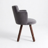 Gray upholstered chair with wooden legs on a white background